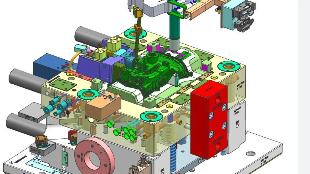 A close-up of a plastic mold and a 3D CAD model on a computer screen.