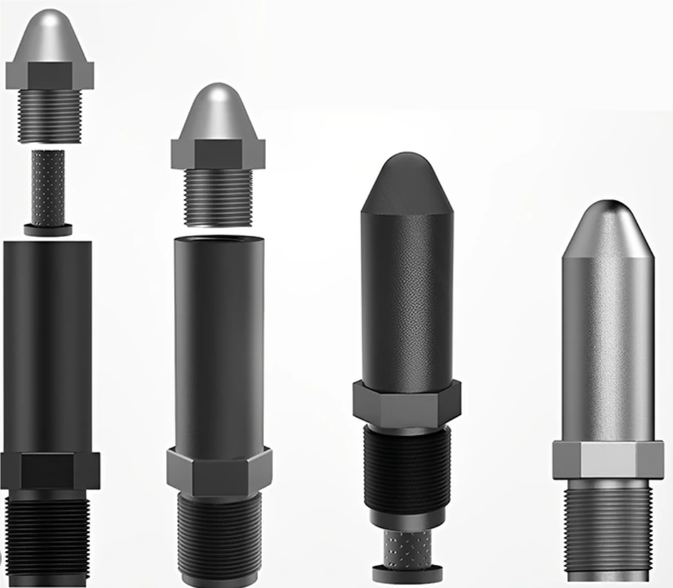 Close-up of various injection molding nozzles with different sizes and apertures.