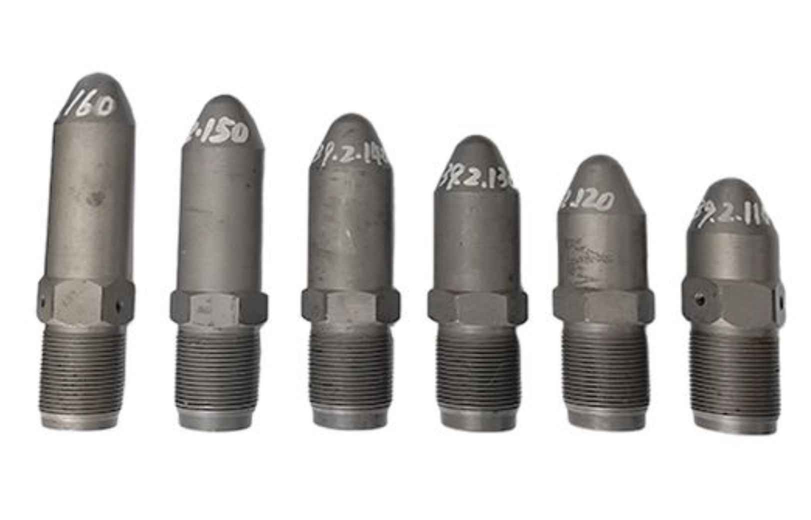 Various injection molding nozzles displayed with plastic parts